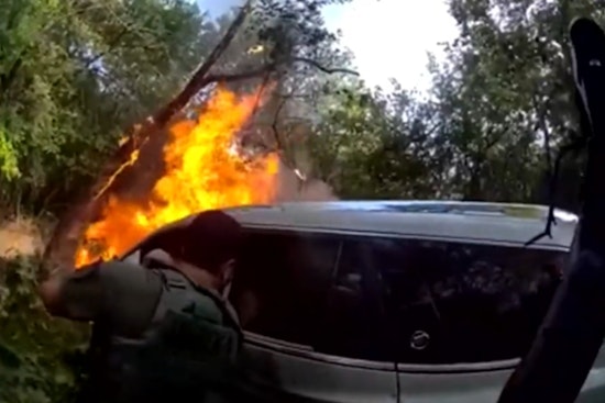 Wise County Officers Smash Car Window to Pull Burning Driver From Woods
