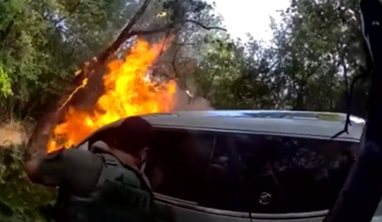 Wise County Officers Smash Car Window to Pull Burning Driver From Woods