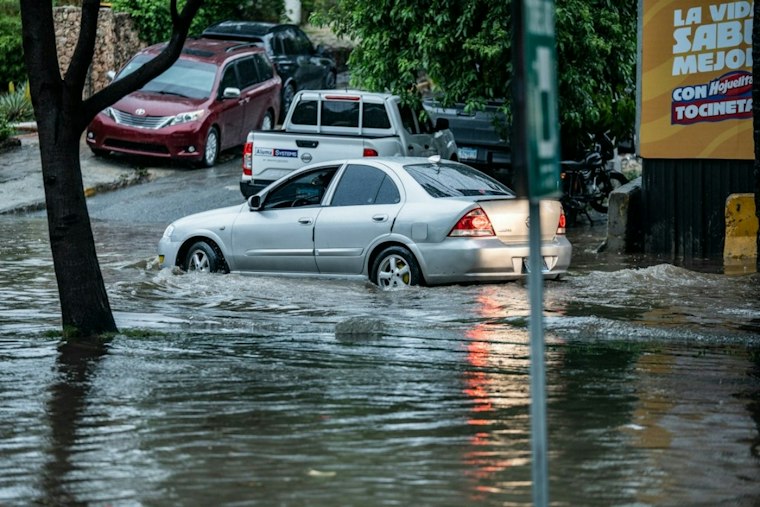 Belmont Road Collapse Traps SUV During Coastal Storm; Cause Remains Unknown