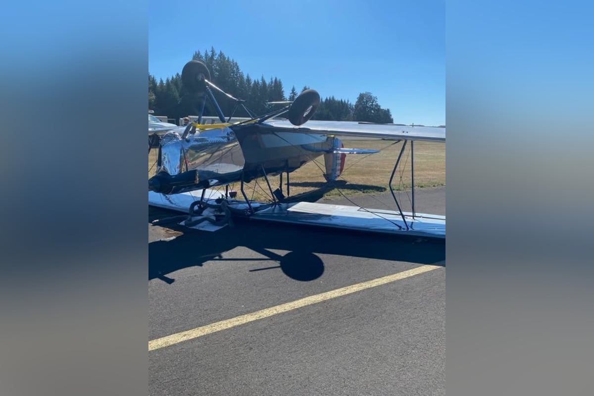 Biplane Flips After Pilot Reports Cabin Smoke Landing at Camas' Grove Field