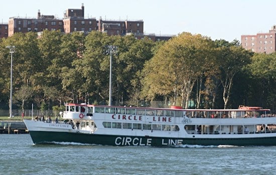 Circle Line's First Nighttime Dog Cruise Sails Past a Lit-Up Statue of Liberty