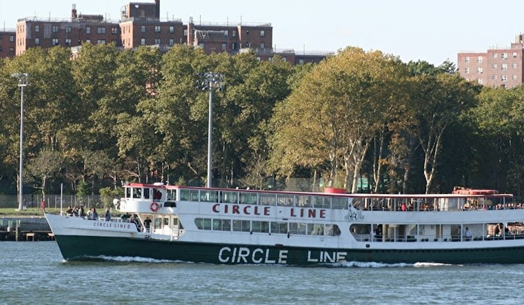 Circle Line's First Nighttime Dog Cruise Sails Past a Lit-Up Statue of Liberty