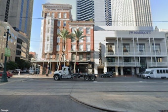 Court Orders Trial Over Who Buys Shuttered Palace Café Building on Canal Street