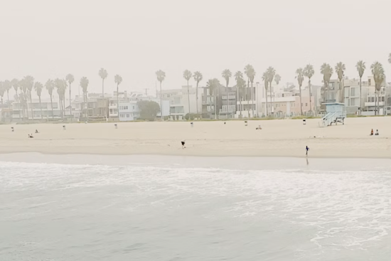 Downtown LA Basks Today, Braces for Soggy, Surf-Pounded Holiday Weekend