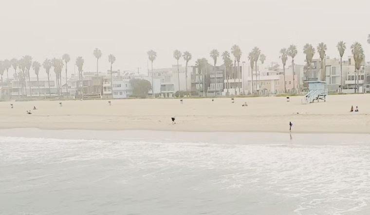 Downtown LA Basks Today, Braces for Soggy, Surf-Pounded Holiday Weekend
