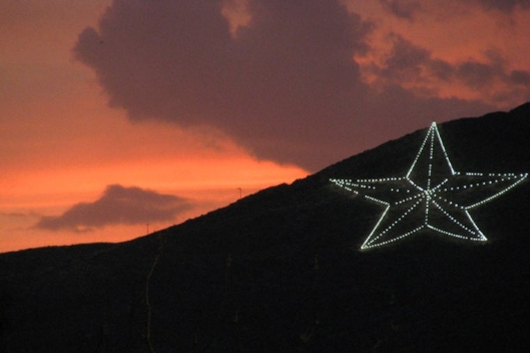 El Paso's Franklin Mountains Star Turns Light Blue for Karol G's Sun Bowl Run
