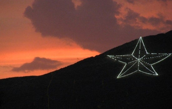 El Paso's Franklin Mountains Star Turns Light Blue for Karol G's Sun Bowl Run
