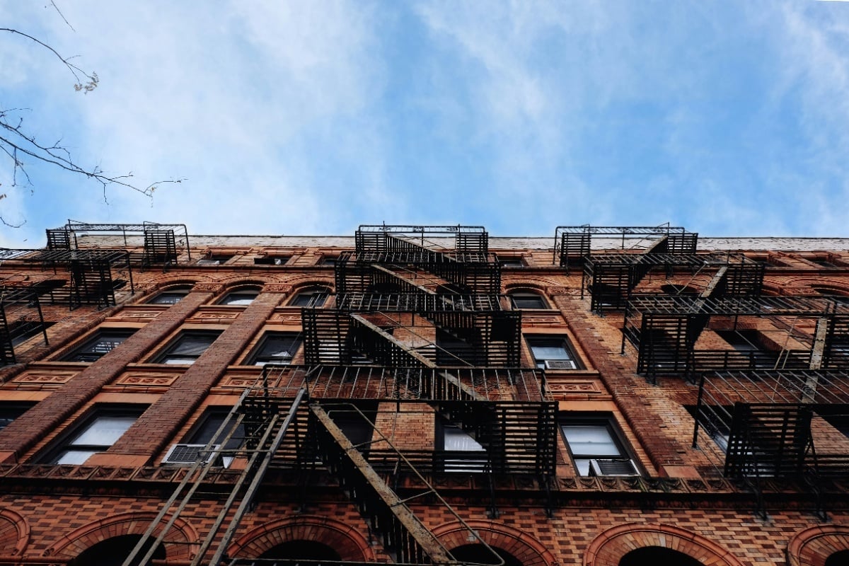 Apartment buildings used with reporting on the federal court ruling blocking New York’s algorithmic rent-setting ban.
