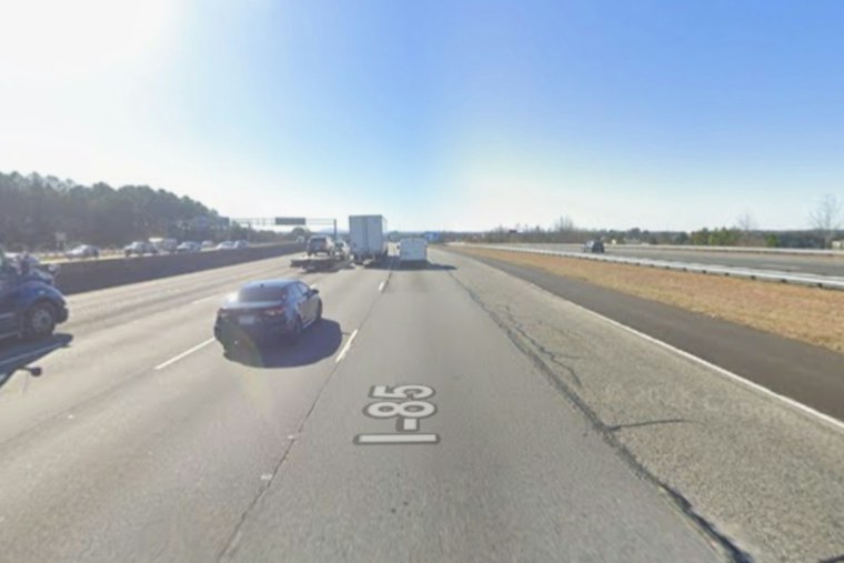 I-85 Crash Near Old Peachtree Road Shatters Barrier, Off-Duty Cops Help Driver