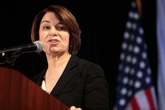 Klobuchar Pitches $180M Health Credit as Demuth Camp Fires Back on Costs