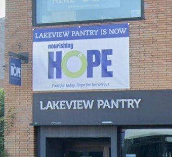Lake View Artist Paints 80-Foot Mural at Nourishing Hope, Comes Full Circle