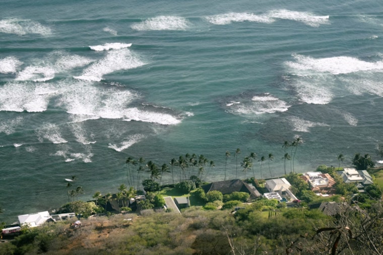 Lowell’s Parting Punch: Flooding Rains, 25-Foot Surf Slam Honolulu