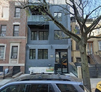 Nor'easter Winds Tear Facade Off Brooklyn Building, Trap Neighbors Outside