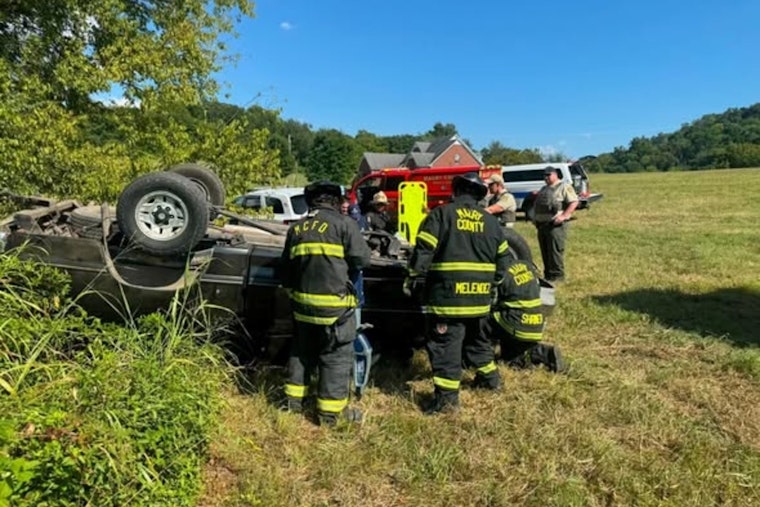 Rollover Off Bud Moore Lane Traps Driver, Crews Rush Tools by Staff Car