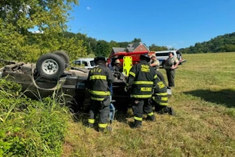 Rollover Off Bud Moore Lane Traps Driver, Crews Rush Tools by Staff Car