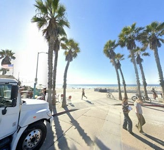Stolen Tesla Barrels Onto Pacific Beach Boardwalk, Critically Injures Woman