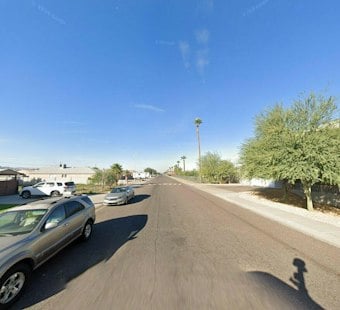 SUV Rollover Sends Vehicle Through South Phoenix Backyard Wall, Two Hospitalized