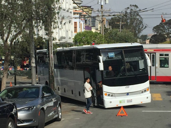 Commuter Bus Holds Up Traffic At Haight And Ashbury