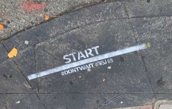 Illegal advertising from the Wall Street Journal appears on city streets