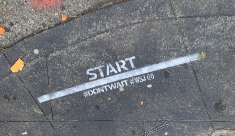 Illegal advertising from the Wall Street Journal appears on city streets