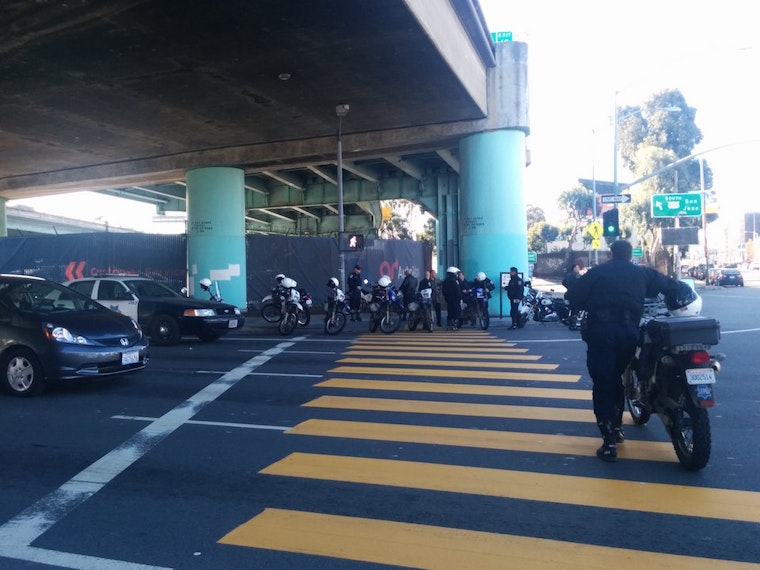 Vehicle Running Red Light Strikes Motorcycle Cop At Seventh & Harrison