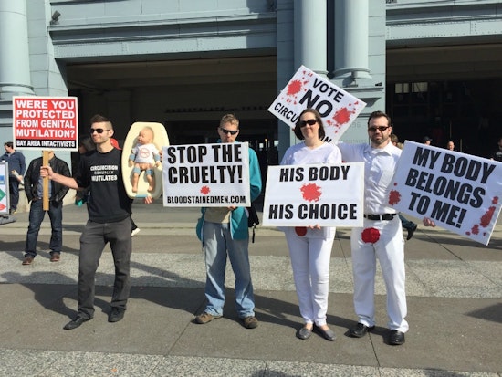 Anti-Circumcision, Labor, Anti-Police Violence Protesters Greet Super Bowl Visitors