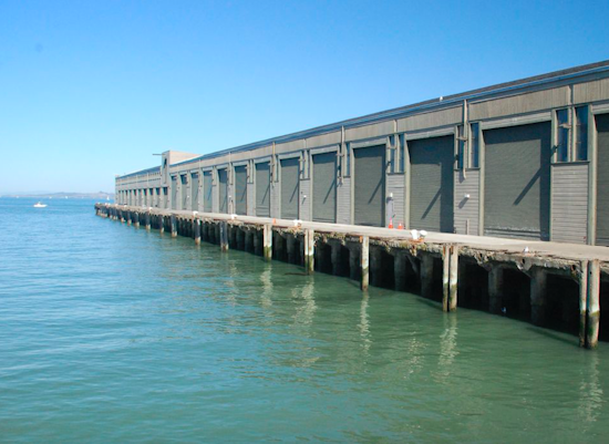 Rescue Divers Pull Elderly Woman From Water At Wharf