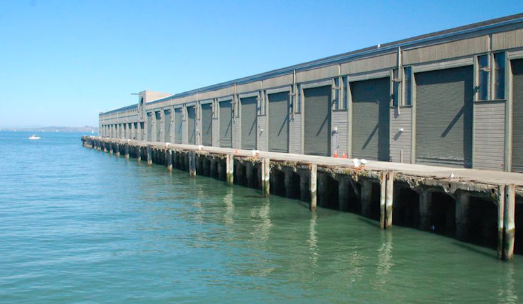Rescue Divers Pull Elderly Woman From Water At Wharf