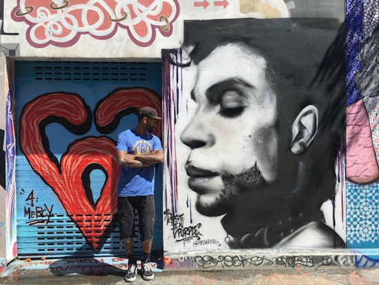 Muralist Mel Waters Pays Tribute To Prince, Gandhi, And Other Iconic Figures