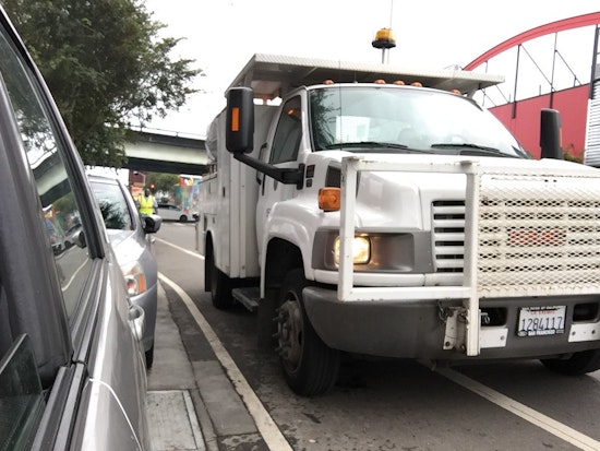 City Vehicle Blocks Bike Lane To Remove Vigilantes' Bike Lane Safety Posts [Updated]