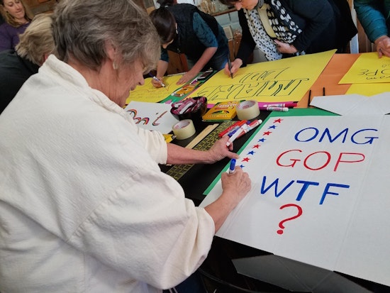 Sign-Making Workshop Brings Protesters Together Before Saturday's Big March