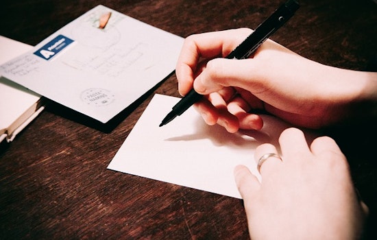 Activist Group 'Social Studies' Launches With Letter Writing Party At Divis Farmer's Market