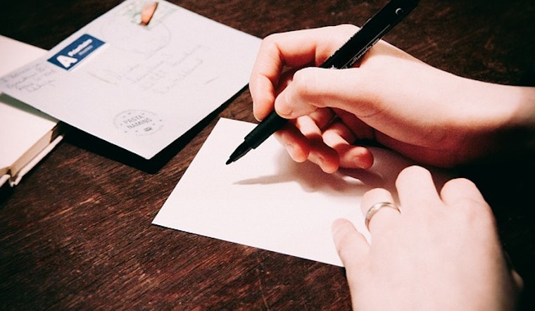 Activist Group 'Social Studies' Launches With Letter Writing Party At Divis Farmer's Market