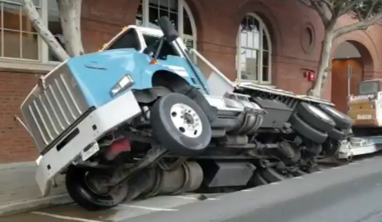 Sinkhole Opens Up Under Truck At 7th And Townsend