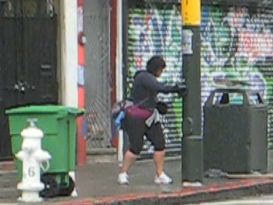 Female Boxer Challenges Haight Street Lamp Post
