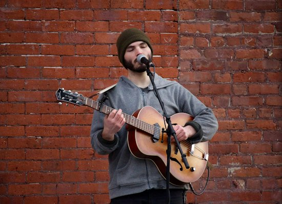 Street Performer Sings for the Love of Music