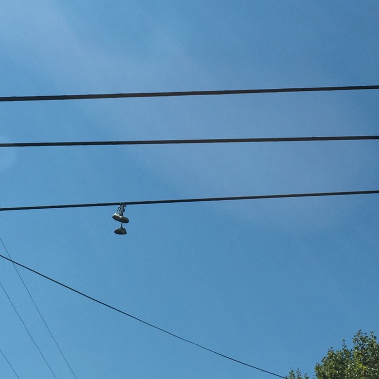 what-do-shoes-hanging-on-wires-signify-drug-trade-street-art