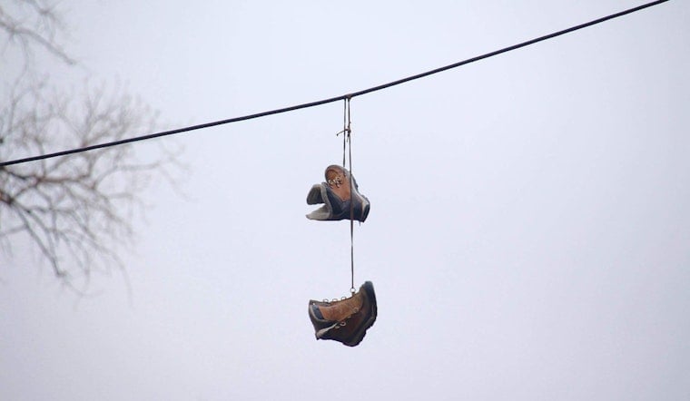 What Does it Really Mean When You See Shoes Hanging from a Telephone Wire?