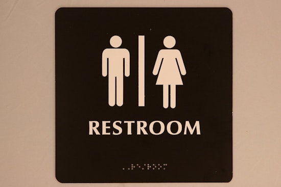 Top Baltimore news: Mayor signs gender-inclusive restroom bill; man charged with impersonating cop