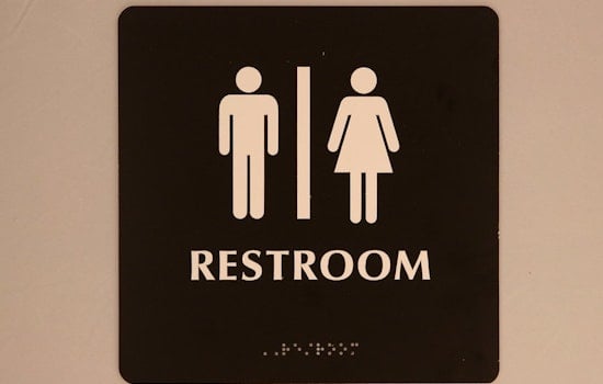 Top Baltimore news: Mayor signs gender-inclusive restroom bill; man charged with impersonating cop
