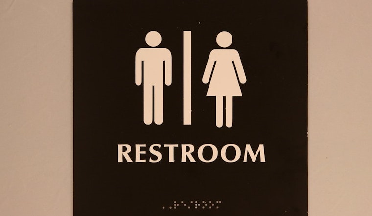 Top Baltimore news: Mayor signs gender-inclusive restroom bill; man charged with impersonating cop