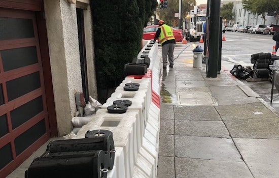 Temporary Flood Barriers Installed At Mission Intersection