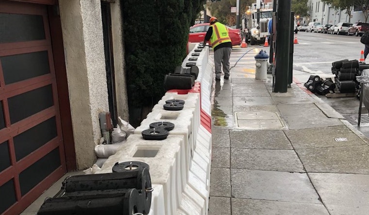Temporary Flood Barriers Installed At Mission Intersection