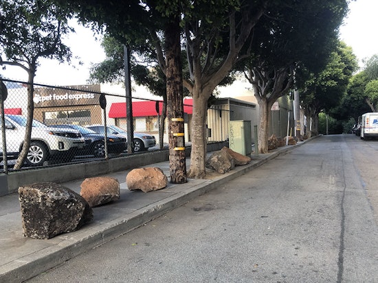 25 boulders mysteriously appear on Clinton Park sidewalk, in apparent anti-encampment measure