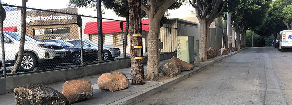25 boulders mysteriously appear on Clinton Park sidewalk, in apparent anti-encampment measure