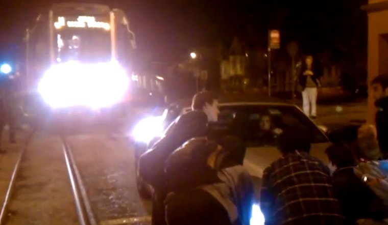 Muni Riders Lift Car Off Duboce Tracks