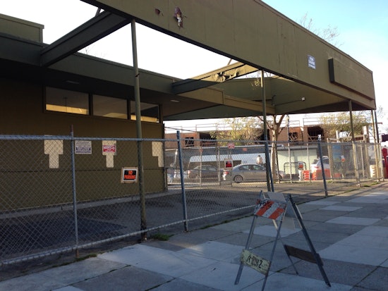 Fence up around Industrialists' parking lot. New Starbucks just around the corner?