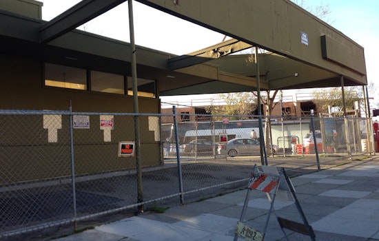 Fence up around Industrialists' parking lot. New Starbucks just around the corner?