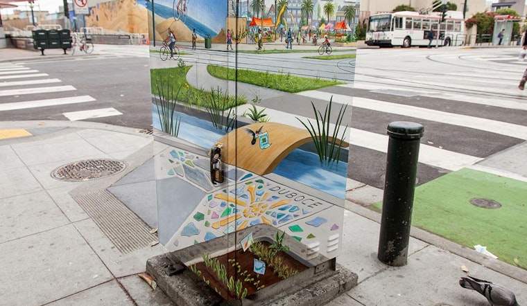 PHOTO: Mona Caron beautifies utility box at Duboce & Church