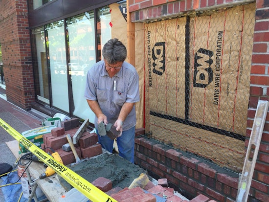 Photo: Bricklayer Tom Peyton Makes Repairs At 750 Battery